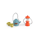 Miniature tea set with teapot, cups, and lantern on a white background