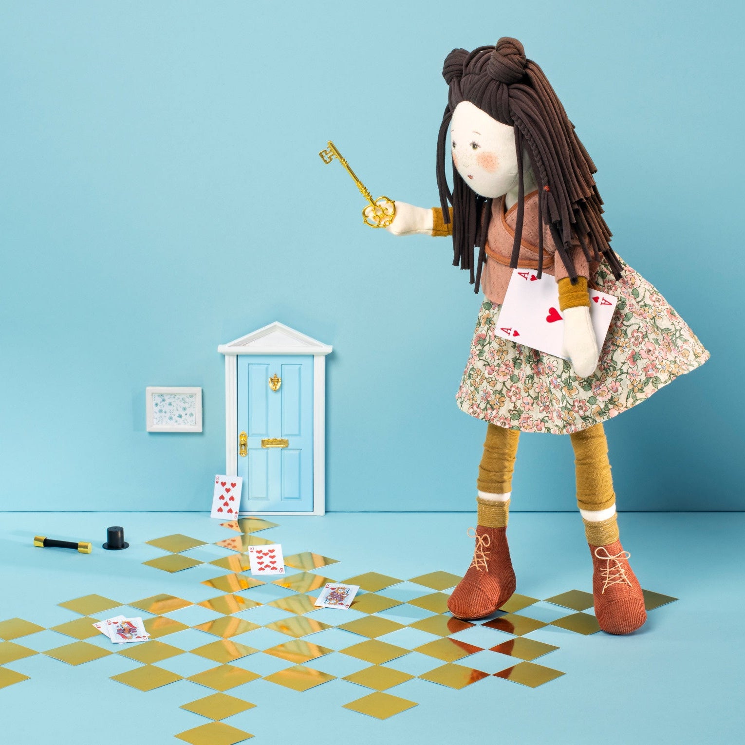 Stuffed doll with a checkered floor and blue wall