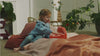 lilliputiens soft doll in a carry cot