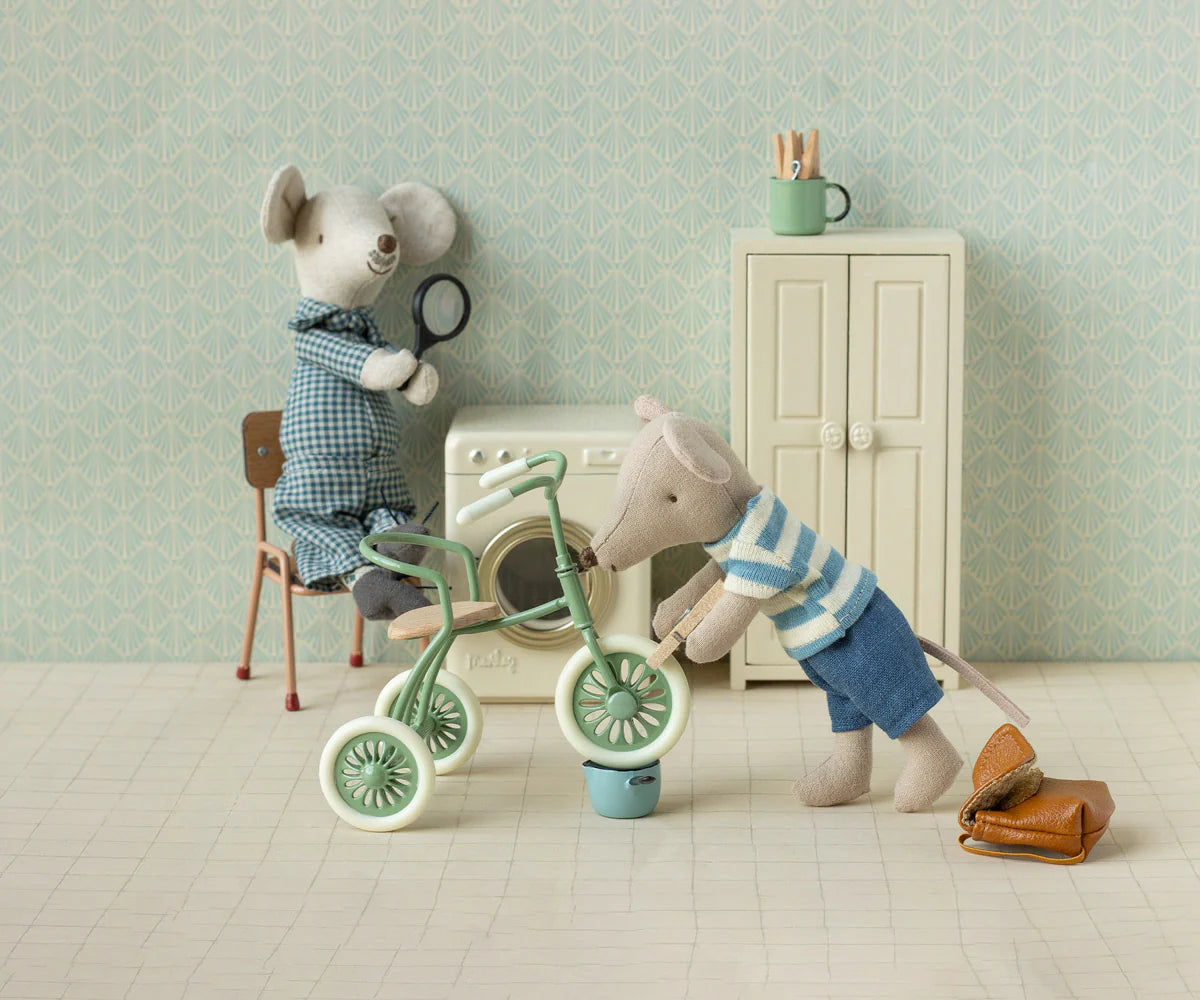 Maileg mice fixing a cycle in a dolls house